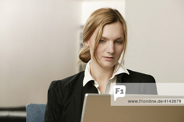 Blonde woman with laptop