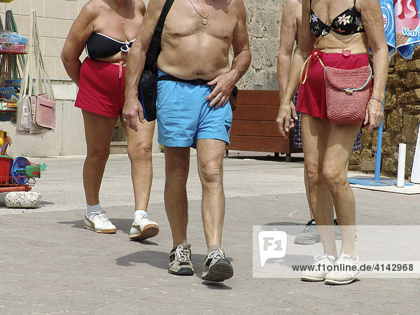 ESP  Spain  Balearic Islands  Mallorca : Half naked tourist  in bathing suits  on a market in Alcudia.
