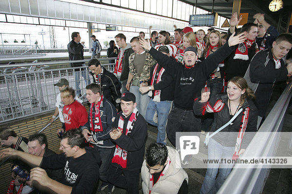 DEU  Germany  Essen : Football fans form the 1.FC Koeln club at a game in Essen against Rot-Weiss Essen. Police is escorting the fans from the railway station to the stadion and back.
