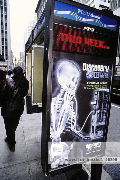 Skeleton at the phone  advertising poster on a phone booth  New York City  USA