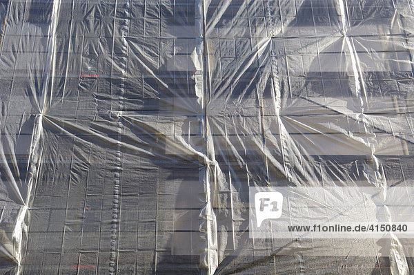 Scaffolding with tarpaulin  encasement