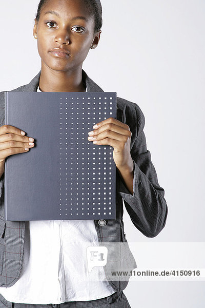 Young woman holding folder