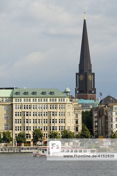 A trip boat called Alsterdampfer passing the historic office buildings at Ballindamm in the city center of Hamburg  Germany