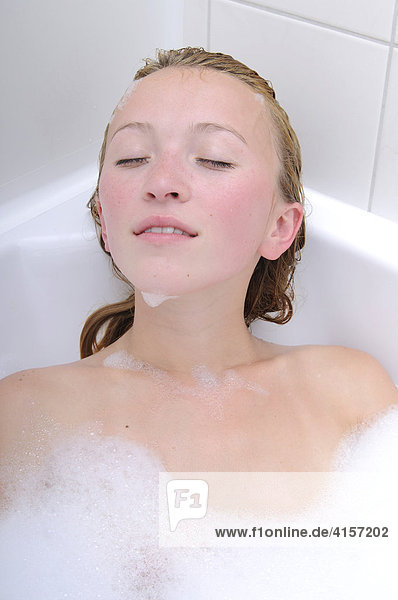 Blonde woman in bathtub