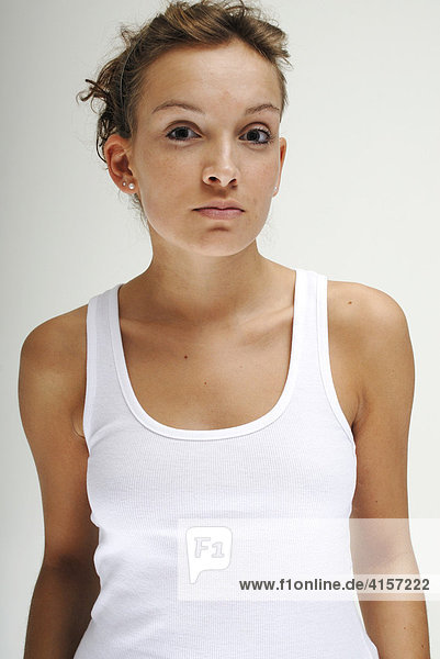 Portrait of a young woman wearing a fine-ribbed undershirt