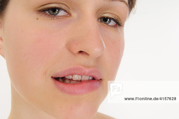 Woman biting on her lip  cutout shot