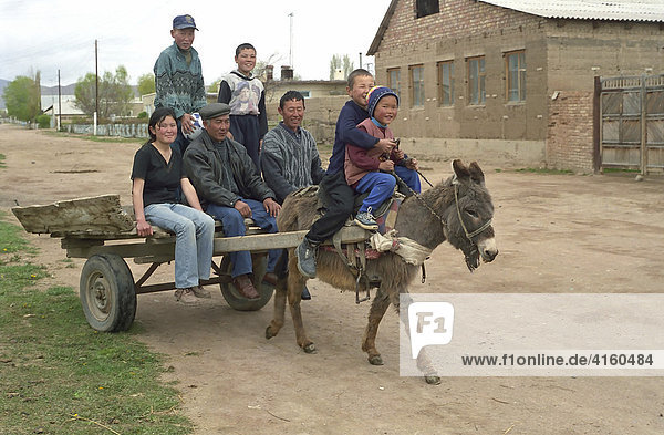 The Kazakh family on donkey cart. Alma-Ata area  Kazakhstan.