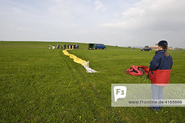 Build-up preparation for a ride in a hot-air balloon Upper Allgaeu Bavaria Germany