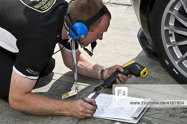 Mechanic collecting technical data  24-hour race at the Nuerburgring racetrack in Nuerburg  Adenau  Rhineland-Palatinate  Germany