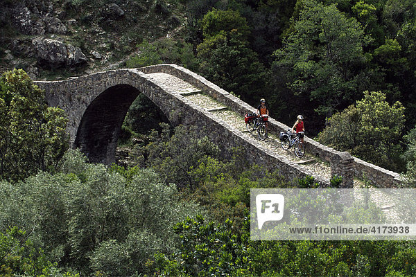 Cyclists  Spelunca gorge  Genuesen bridge  Ota  Corsica  France