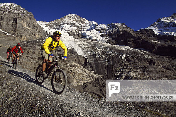 Mountain bikers  Moench  Eiger Glacier  Little Scheidegg  Grindelwald  Bernese Oberland  Switzerland