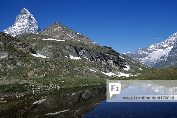 Mountain biker  Schwarzsee (Schwarz Lake)  Mt. Matterhorn  Zermatt  Valais  Switzerland  Europe