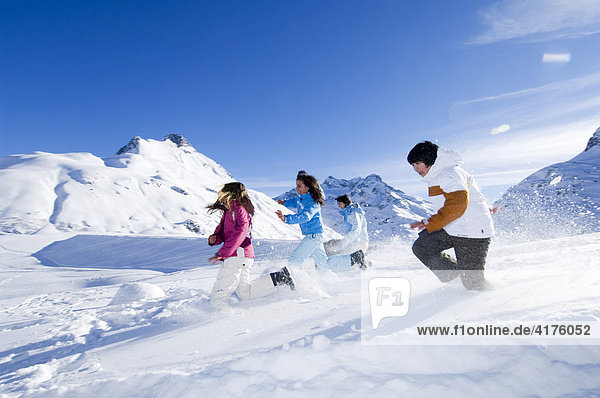 Children having a snowball fight  Galtuer  Tirol  Austria  Europe