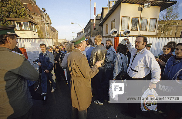 Fall of the Berlin Wall: citizens from East Berlin return with shopping bags at the border crossing Invalidenstrasse  Berlin  Germany