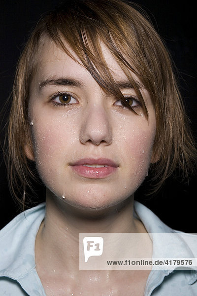 Young woman's wet face