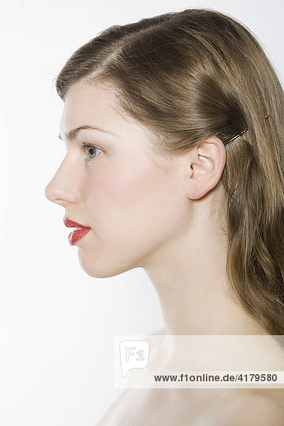Young woman's profile  red lips