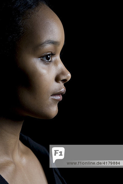 Portrait of a young dark-skinned woman's face  profile
