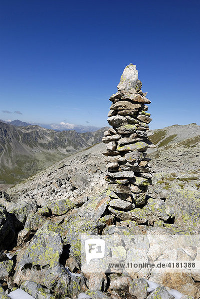 Stone man used as signpost along a hiking trail  Swiss Alps  Switzerland  Europe