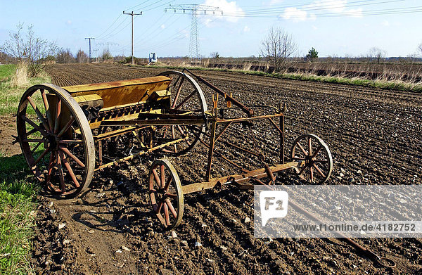 Old drilling machine in a field