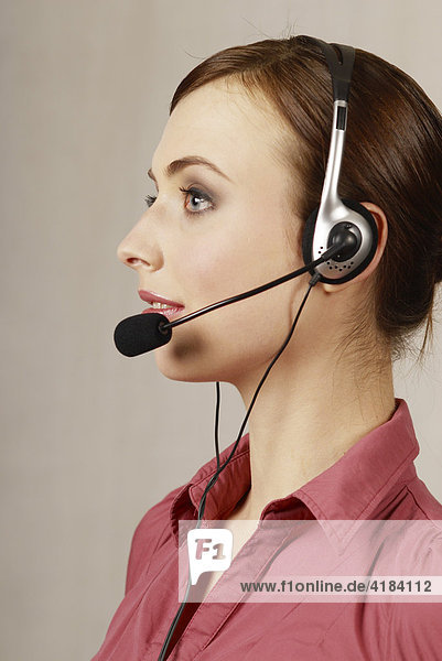 Young woman with headset  call center  telephone operator