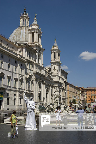 Piazza Navona  Navona Place  Church St. Angnese in Agona and egyptian obelisk  Pantomime as liberty statue  Rome  Italy.
