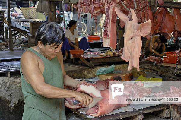 Butcher at Bahan market  Yangon  Myanmar  Burma