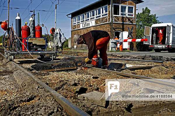 Track construction at a railway level crossing near Calau in Niederlausitz  Brandenburg  Germany