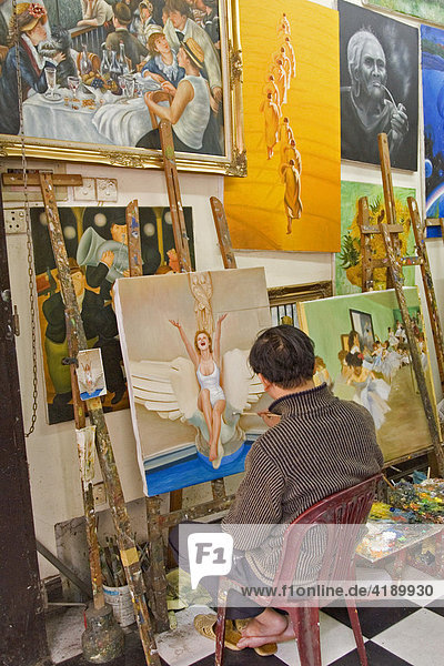 Artist copying paintings in Hanoi  Vietnam  Asia