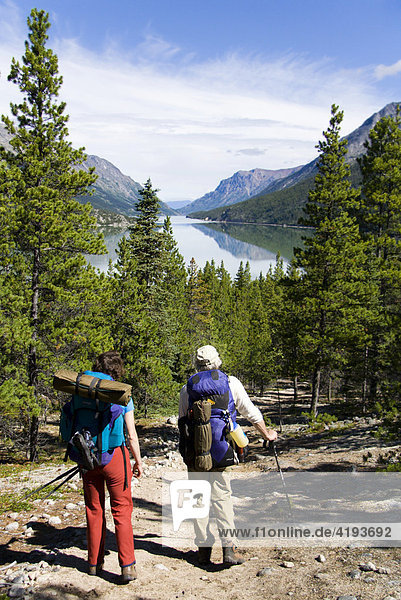 Hikers enjoying a view of Lake Bennett  Chilkoot Trail  British Columbia  Canada