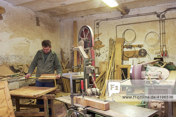 Hungarian carpenter working in carpenters workshop