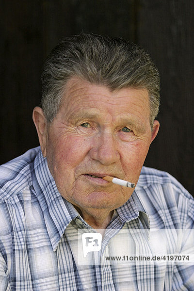 Portrait of smoking old man