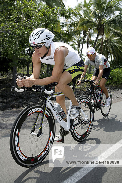 Triathlets Stephan Vuckovic (GER) and Thomas Hellriegel (GER) cycling in Kailua-Kona Hawaii USA