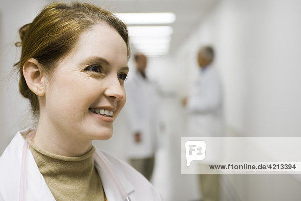 Healthcare worker smiling  looking away  portrait