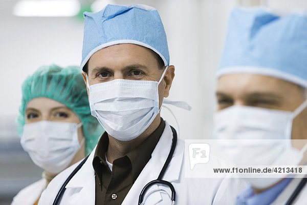 Doctors wearing surgical masks