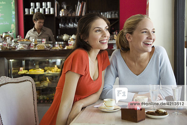 Female friends together at cafe