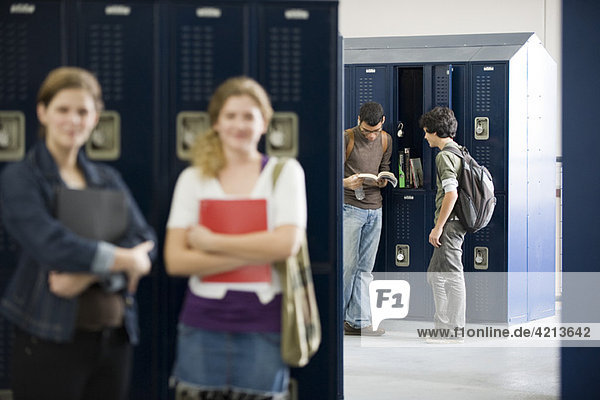 High school students chatting by lockers