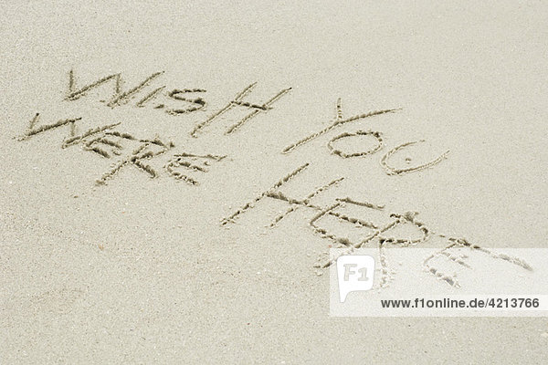 Wish you were here written in sand