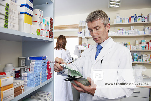 Pharmacist looking at prescription