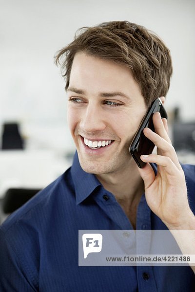 Smiling man talking in phone