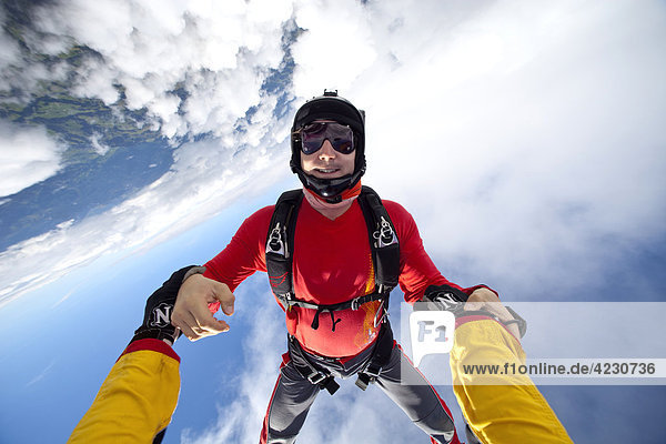Two male parachute jumpers,  Saanen,  Canton Bern,  Switzerland