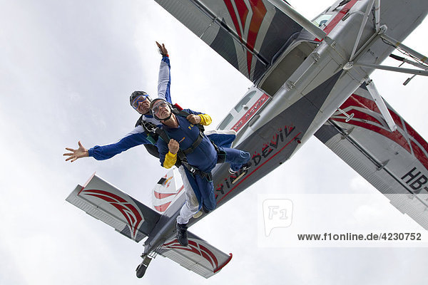Two men doing parachute jumping  Saanen  Canton Bern  Switzerland
