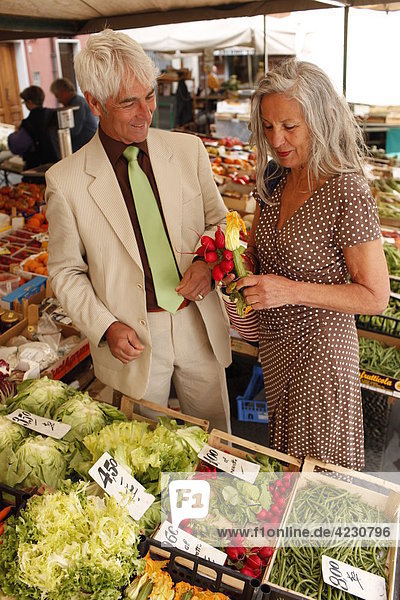 Senior couple on a vegetable market  Italy  Rapallo
