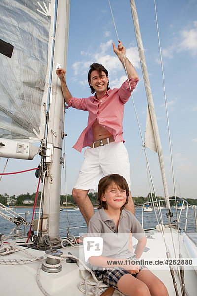 Father and son on board yacht  portrait
