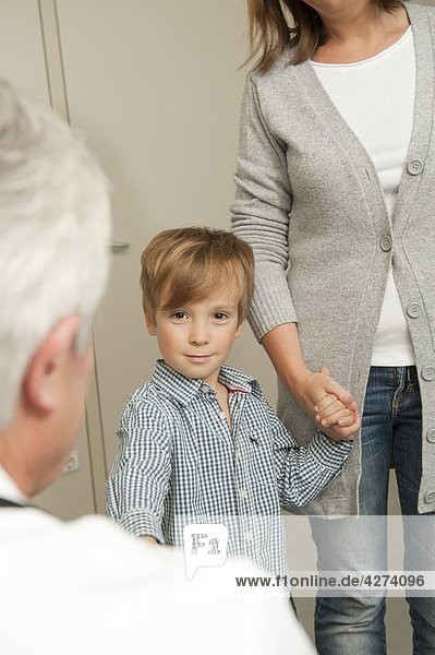 Boy with mother at the doctor