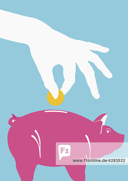 Hand wirft Geldmünze in Sparschwein