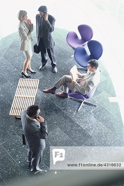 Business executives in lobby  high angle view