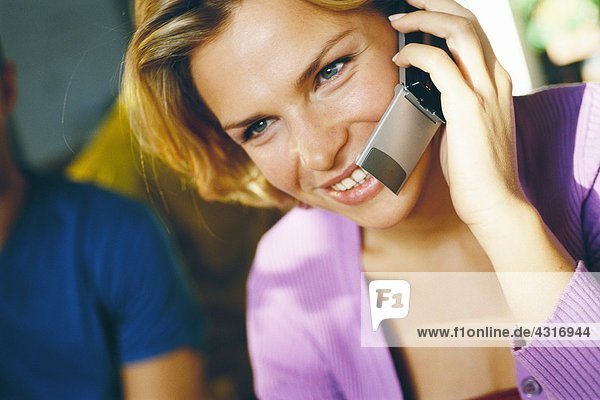 Woman using cell phone  close-up
