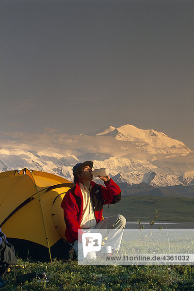 Backpacker by Tent w/Mt McKinley Denali NP IN AK Summer