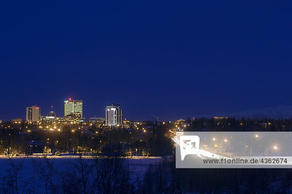 Skyline view of Anchorage  Alaska at night during Winter