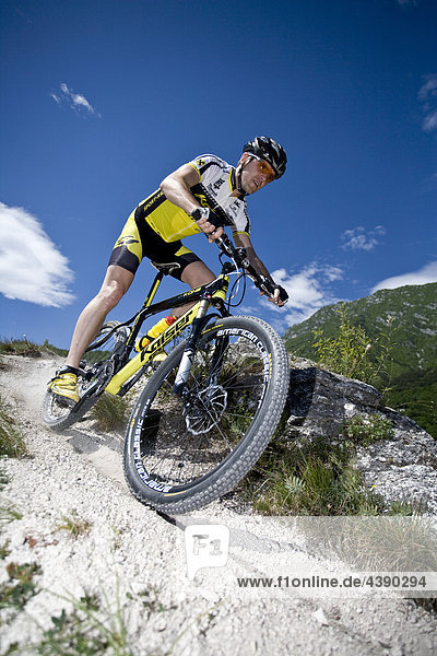 Mountainbiking  lake Garda  Pregasina  Trentino  Italy  riding a bike  bicycle  bicycle  bike  biking  man  tour  sport  skill  balance  Alps